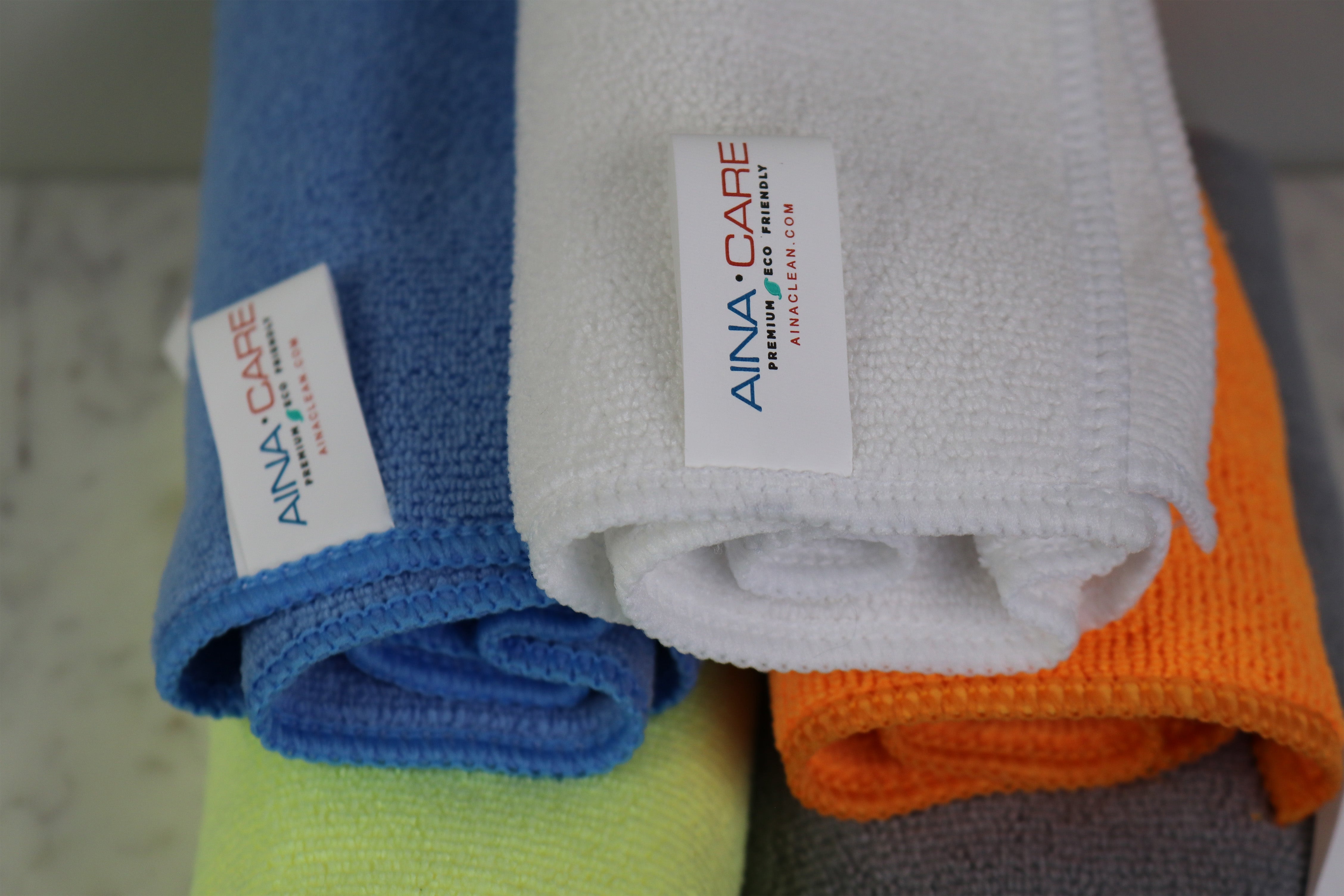 Close up aerial view of each of the five microfiber cloth colors in a pyramid stack.