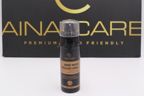 A bottle of Water Repellent Spray from AinaCare sitting in front of their logo on a box.